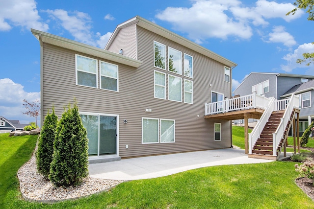 883 Water Ridge Dr, Byron Center, MI 49315 - back of property with stairs, a deck, a lawn, and a patio