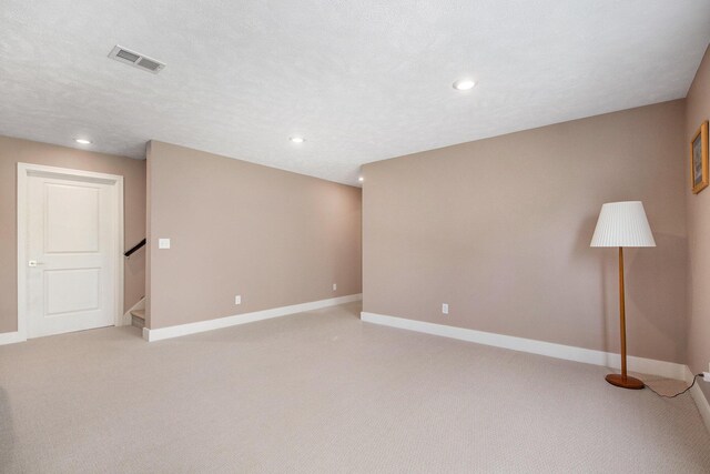 883 Water Ridge Dr, Byron Center, MI 49315 - unfurnished room with light carpet, baseboards, stairs, and recessed lighting