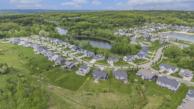 883 Water Ridge Dr, Byron Center, MI 49315 - view of property location with a nearby body of water, a forest, and nearby suburban area