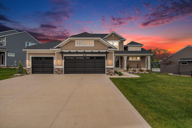 883 Water Ridge Dr, Byron Center, MI 49315 - craftsman-style home with a garage, stone siding, board and batten siding, driveway, and covered porch