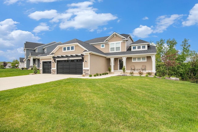 883 Water Ridge Dr, Byron Center, MI 49315 - craftsman-style house with concrete driveway, a front lawn, covered porch, stone siding, and board and batten siding
