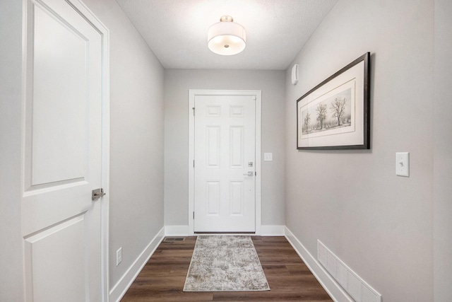 883 Water Ridge Dr, Byron Center, MI 49315 - entryway with dark wood-type flooring and baseboards