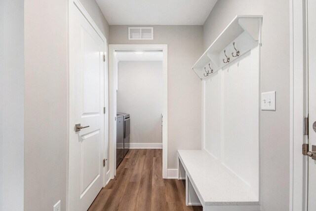 883 Water Ridge Dr, Byron Center, MI 49315 - mudroom featuring washer and clothes dryer, dark wood-style flooring, and baseboards