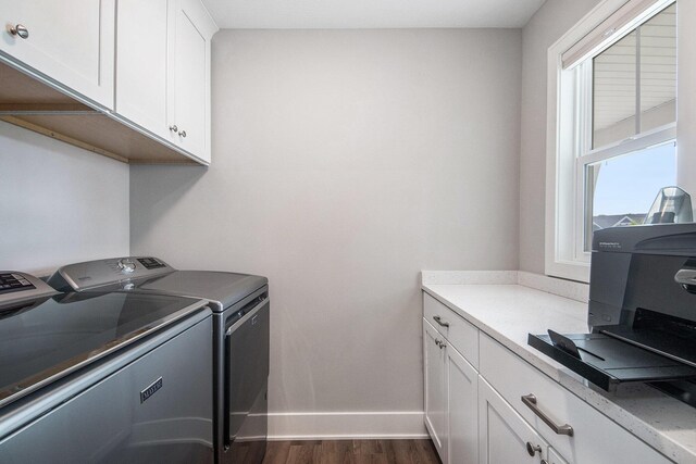 883 Water Ridge Dr, Byron Center, MI 49315 - laundry room featuring separate washer and dryer, dark wood-style floors, baseboards, and cabinet space