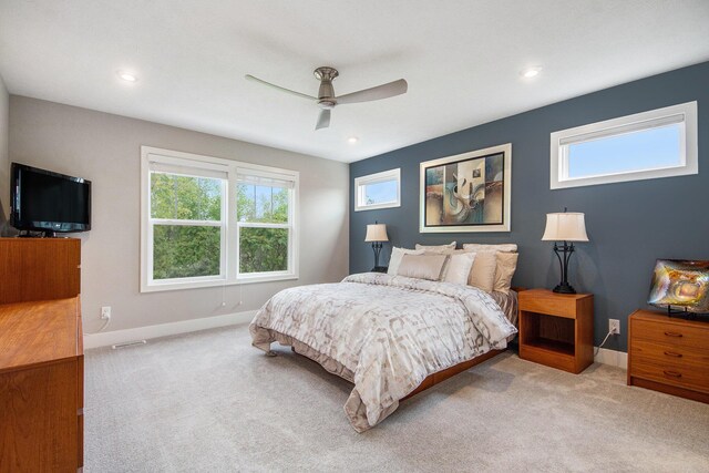 883 Water Ridge Dr, Byron Center, MI 49315 - carpeted bedroom featuring multiple windows, baseboards, ceiling fan, and recessed lighting