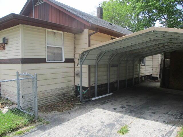 322 Crescent St, Watervliet, MI 49098 - view of parking featuring a carport