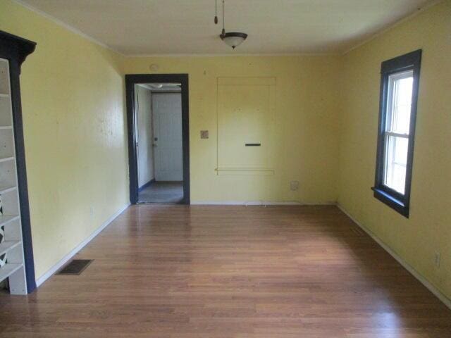 322 Crescent St, Watervliet, MI 49098 - empty room featuring wood finished floors and baseboards