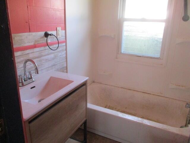 322 Crescent St, Watervliet, MI 49098 - full bathroom featuring vanity and washtub / shower combination