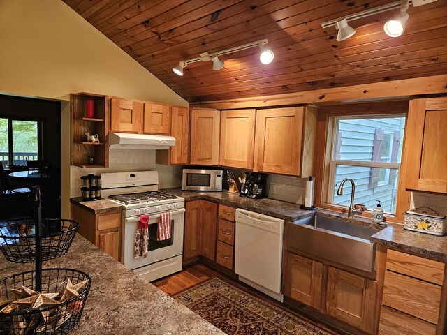 3354 E Arthur, Rothbury, MI 49452 - kitchen with white appliances, rail lighting, lofted ceiling, wooden ceiling, and a sink
