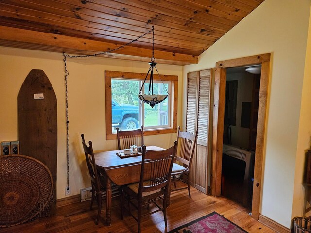 3354 E Arthur, Rothbury, MI 49452 - dining room with wood ceiling, light wood-type flooring, lofted ceiling, and baseboards