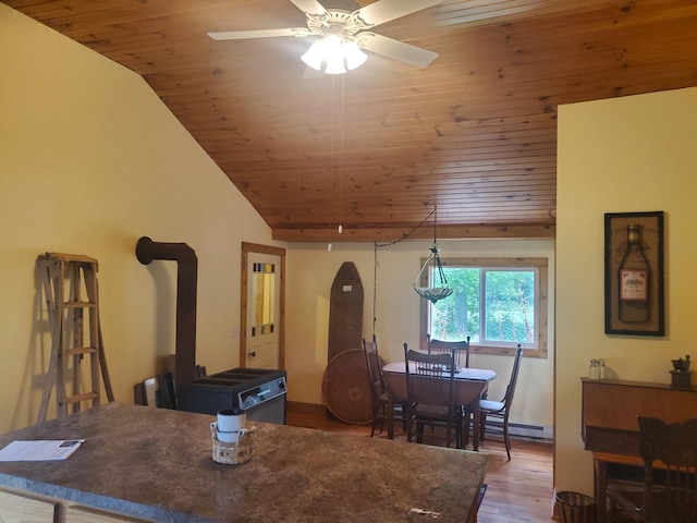 3354 E Arthur, Rothbury, MI 49452 - dining room with wooden ceiling, ceiling fan, wood finished floors, a baseboard heating unit, and vaulted ceiling