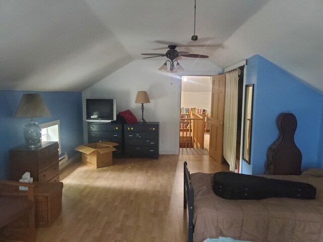 3354 E Arthur, Rothbury, MI 49452 - bedroom featuring light wood-style flooring, lofted ceiling, ceiling fan, baseboards, and a baseboard radiator