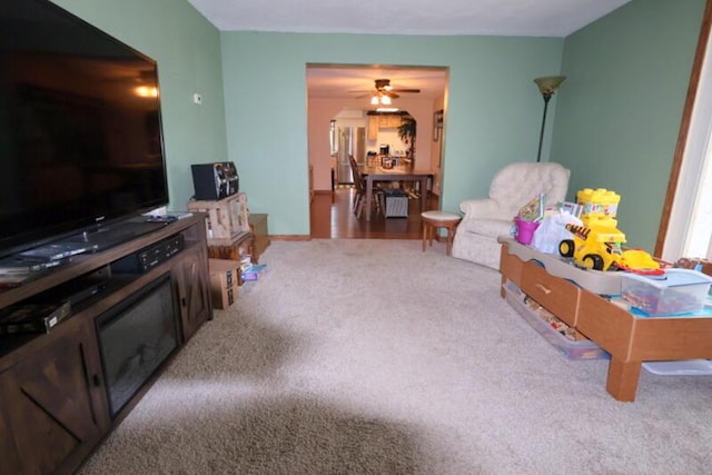 606 E Girard Rd, Quincy, MI 49082 - living room featuring carpet and ceiling fan