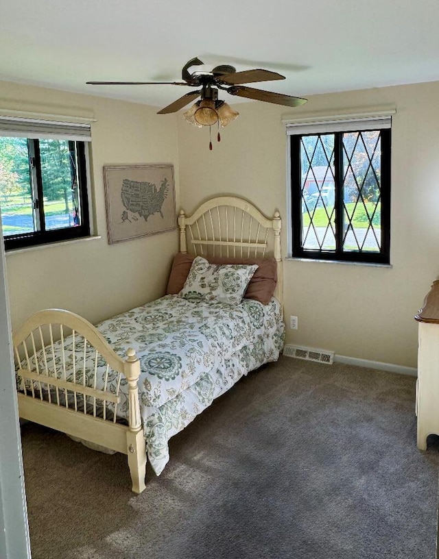 3671 Lido, Highland, MI 48356 - bedroom with multiple windows, carpet, ceiling fan, and baseboards