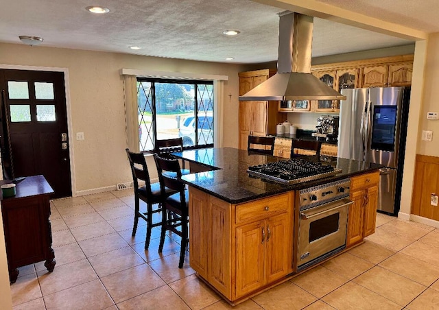 3671 Lido, Highland, MI 48356 - kitchen with appliances with stainless steel finishes, island exhaust hood, light tile patterned flooring, a center island, and recessed lighting
