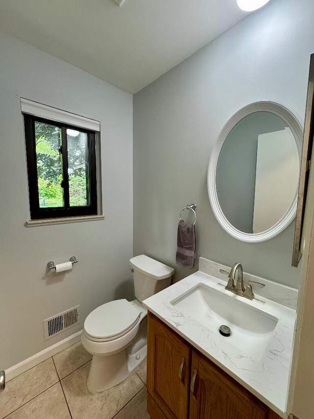 3671 Lido, Highland, MI 48356 - half bathroom with toilet, vanity, tile patterned floors, and baseboards
