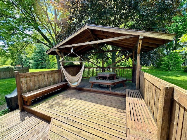 3671 Lido, Highland, MI 48356 - wooden terrace with a gazebo, a lawn, and view of wooded area