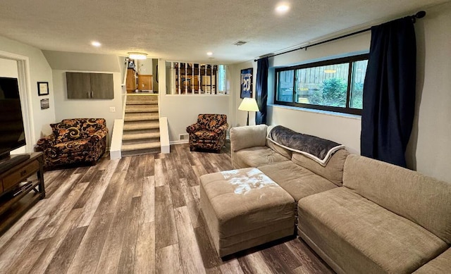 3671 Lido, Highland, MI 48356 - living area with wood finished floors, a textured ceiling, stairway, and recessed lighting
