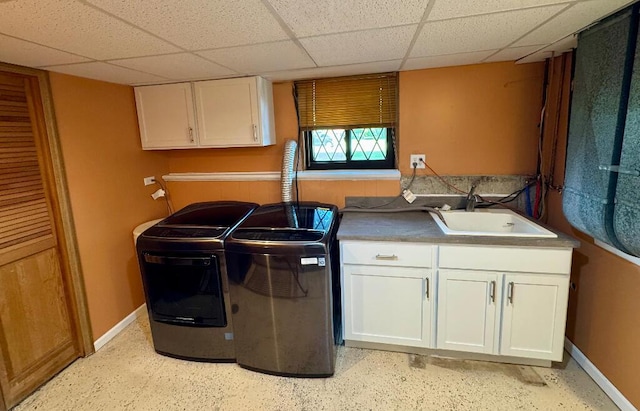 3671 Lido, Highland, MI 48356 - washroom featuring cabinet space, baseboards, and washing machine and dryer