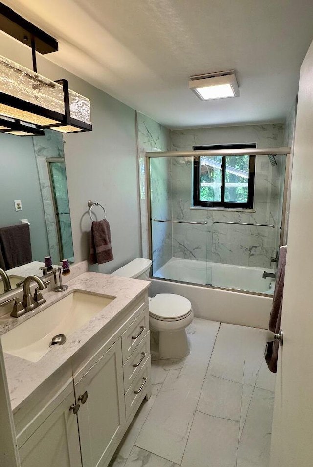 3671 Lido, Highland, MI 48356 - bathroom featuring vanity, toilet, enclosed tub / shower combo, and marble finish flooring