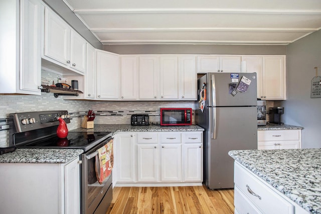 787 Doves Lndg, Coldwater, MI 49036 - kitchen with stainless steel appliances, light wood-type flooring, white cabinets, decorative backsplash, and light stone counters