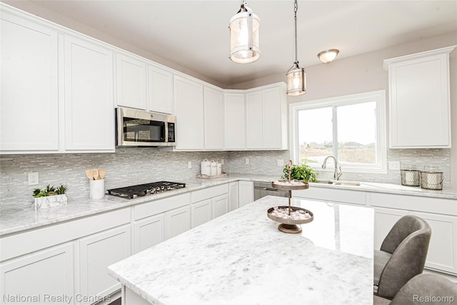 20 Medford Hill Dr, Metamora, MI 48455 - kitchen featuring stainless steel appliances, a sink, white cabinetry, and decorative backsplash