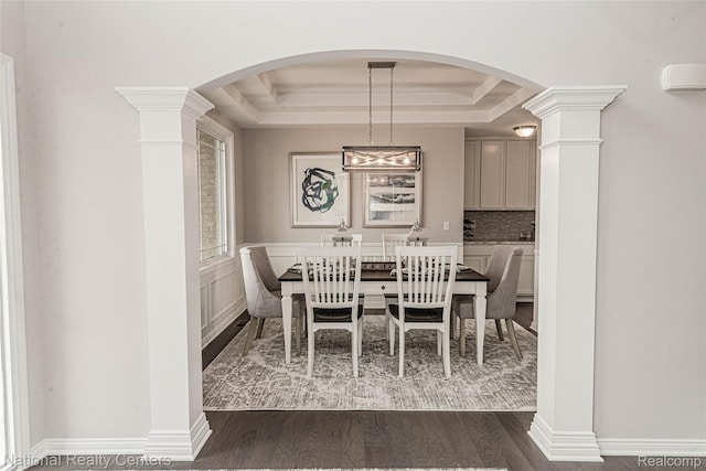 20 Medford Hill Dr, Metamora, MI 48455 - dining space with a raised ceiling, dark wood-type flooring, and decorative columns