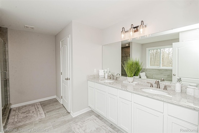 20 Medford Hill Dr, Metamora, MI 48455 - bathroom with double vanity, baseboards, and an enclosed shower