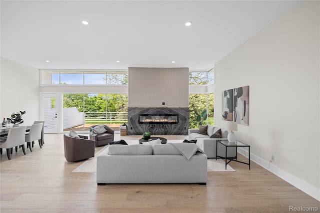 1752 Alexander Dr, Bloomfield, MI 48302 - living area with healthy amount of natural light, a high end fireplace, recessed lighting, light wood-style flooring, and baseboards