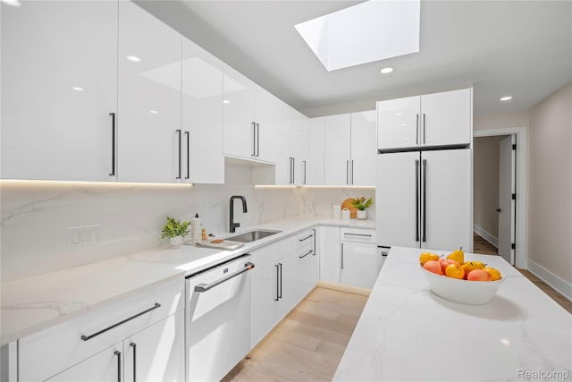 1752 Alexander Dr, Bloomfield, MI 48302 - kitchen featuring white appliances, modern cabinets, a skylight, white cabinets, and recessed lighting