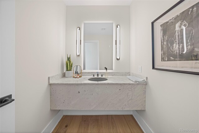 1752 Alexander Dr, Bloomfield, MI 48302 - bathroom with baseboards, wood finished floors, and vanity