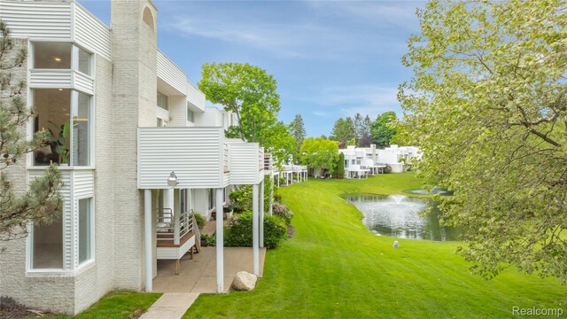 1752 Alexander Dr, Bloomfield, MI 48302 - view of grassy yard featuring a water view and a patio