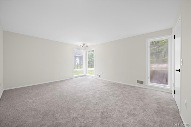 1752 Alexander Dr, Bloomfield, MI 48302 - carpeted empty room with baseboards and a chandelier