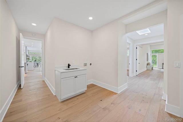 1752 Alexander Dr, Bloomfield, MI 48302 - hall featuring a sink, light wood-style floors, plenty of natural light, and recessed lighting
