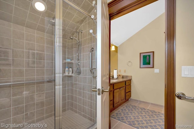 4150 Port Austin Rd, Caseville, MI 48725 - bathroom featuring vanity, lofted ceiling, a shower stall, and tile patterned floors