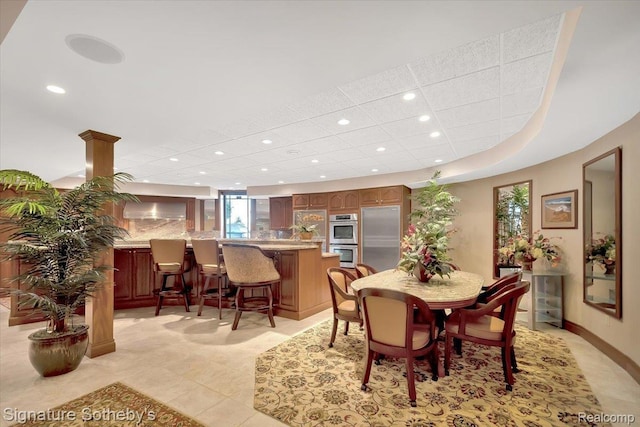 4150 Port Austin Rd, Caseville, MI 48725 - dining area with recessed lighting, bar area, and light tile patterned floors