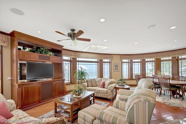 4150 Port Austin Rd, Caseville, MI 48725 - living room with ceiling fan, light wood-style flooring, recessed lighting, and a skylight