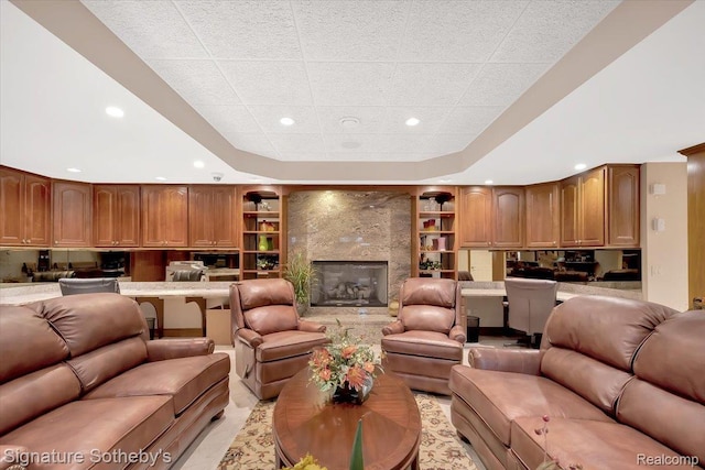 4150 Port Austin Rd, Caseville, MI 48725 - living area featuring recessed lighting, a tray ceiling, built in shelves, and a high end fireplace