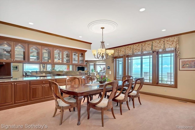 4150 Port Austin Rd, Caseville, MI 48725 - dining area featuring a chandelier, ornamental molding, light carpet, recessed lighting, and baseboards