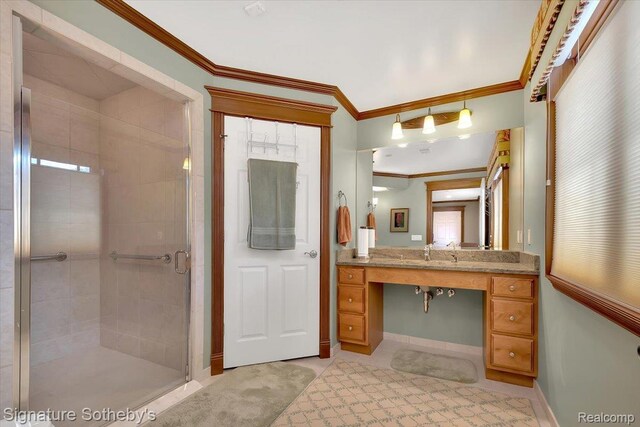 4150 Port Austin Rd, Caseville, MI 48725 - full bathroom with a shower stall, vanity, crown molding, and baseboards