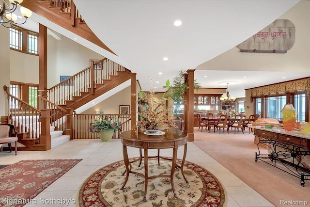 4150 Port Austin Rd, Caseville, MI 48725 - tiled living area featuring a chandelier, stairs, recessed lighting, carpet flooring, and a towering ceiling