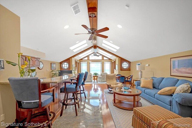 4150 Port Austin Rd, Caseville, MI 48725 - living area featuring a ceiling fan, a skylight, lofted ceiling, recessed lighting, and light wood-style floors