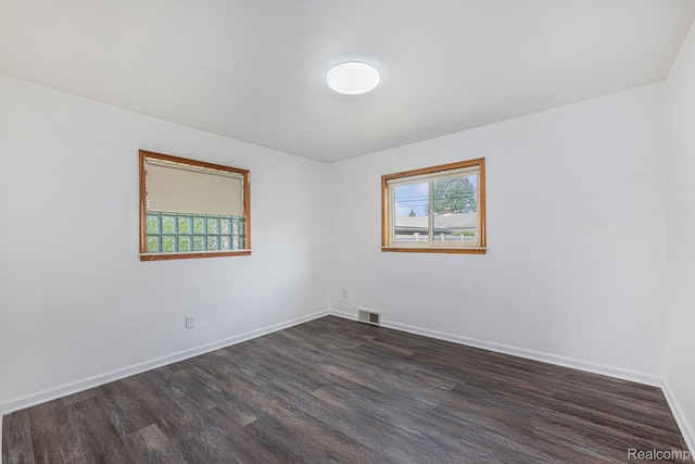 5239 E 13 Mile Rd, Warren, MI 48092 - empty room with dark wood-type flooring and baseboards