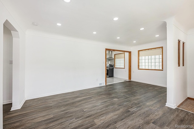 5239 E 13 Mile Rd, Warren, MI 48092 - spare room featuring wood finished floors, recessed lighting, baseboards, and arched walkways