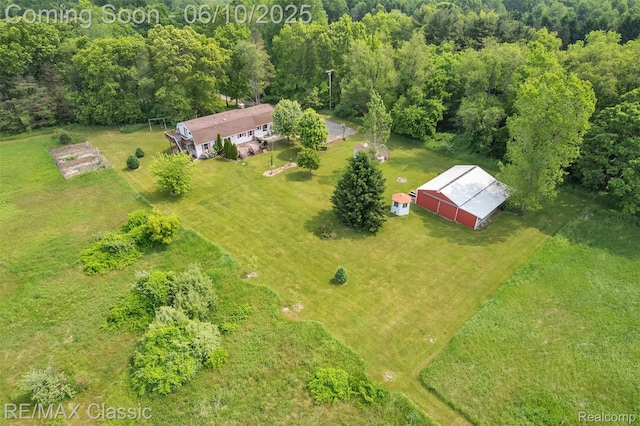 917 Middle Rd, Highland, MI 48357 - overview of rural landscape with a heavily wooded area