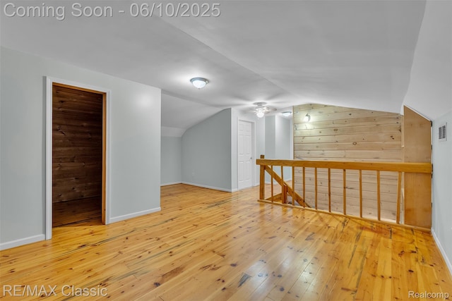 917 Middle Rd, Highland, MI 48357 - bonus room featuring hardwood / wood-style floors, vaulted ceiling, and baseboards