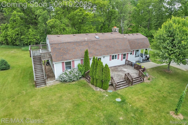 917 Middle Rd, Highland, MI 48357 - rear view of property featuring stairway, a wooden deck, a lawn, and a shingled roof