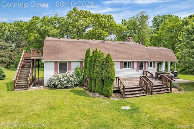 917 Middle Rd, Highland, MI 48357 - view of front of property featuring stairs, a shingled roof, a wooden deck, and a front yard