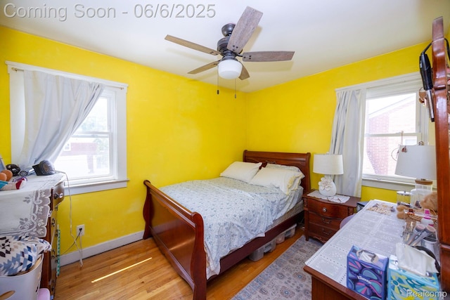 224 Mohawk St, Dearborn, MI 48124 - bedroom featuring wood finished floors, a ceiling fan, and baseboards