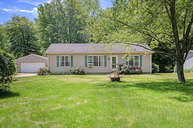 1417 Greenhouse Rd, Bangor, MI 49013 - ranch-style house featuring an outbuilding, a garage, a front yard, and a fire pit